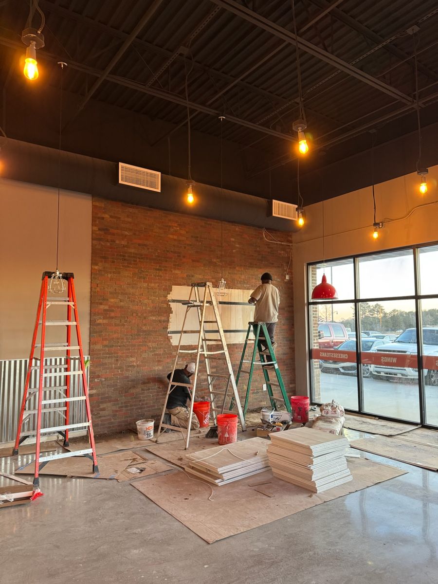 Brick accent wall being installed